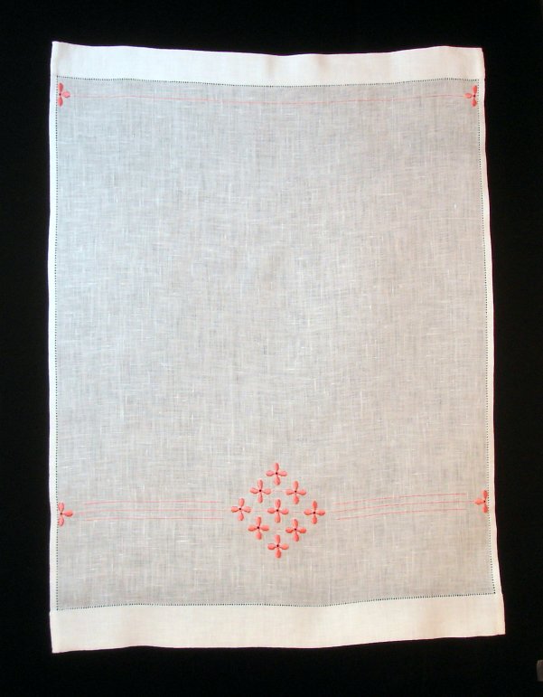 Pinstitched hand towel with padded satin stitch flowers