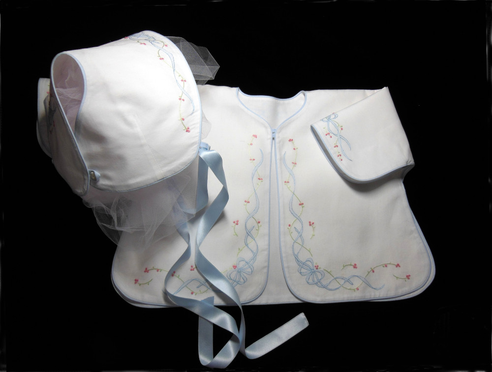 A bonnet and cover up to match a pair of baby sandals